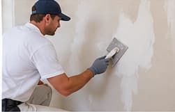 Wall repair and plaster patching before painting