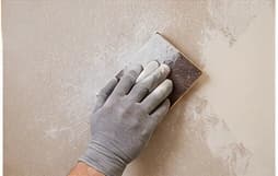 Spackling and sanding an interior wall